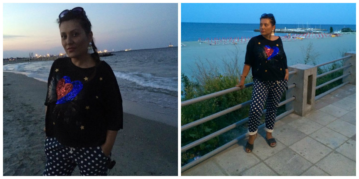 Bianca Rus s-a plimbat pe plajă îmbrăcată într-o bluză şi o pereche de pantaloni lungi.