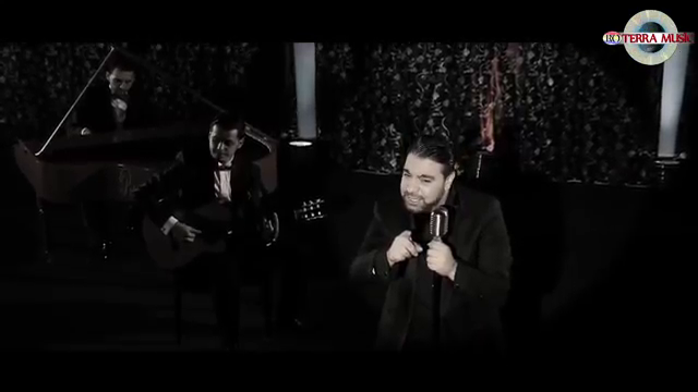 Florin Salam apare imbracat in costum negru, elegant, in ultimul videoclip
