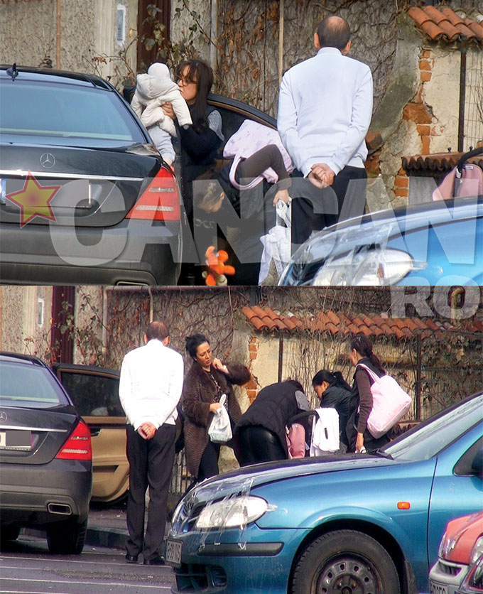 Mama Oanei ia copilul din maşina în care soţia lui Vanghelie asteapta ca toate sa fie organizate inainte sa coboare