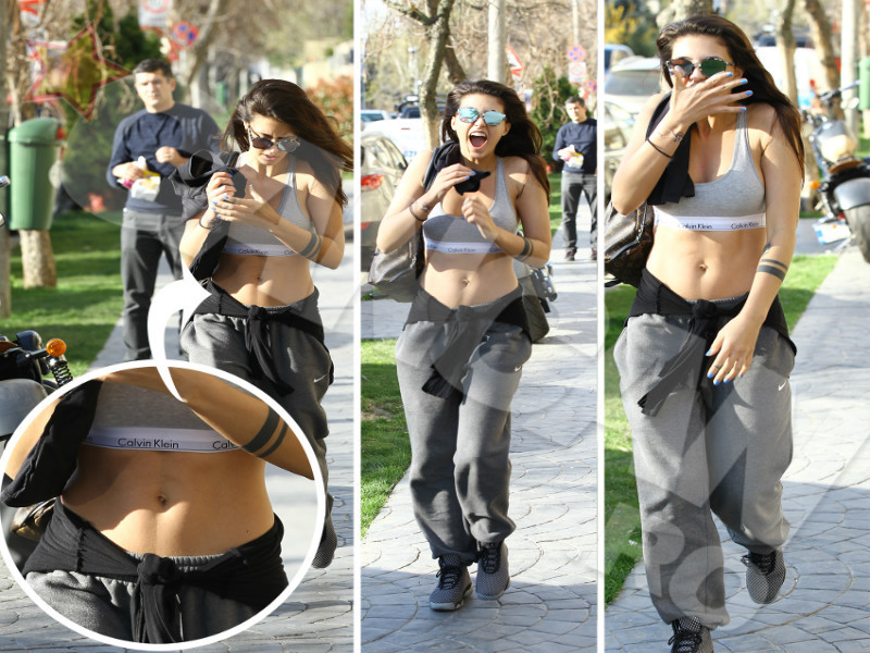 Antonia a ieşit pe stradă, expunându-şi abdomenul în toată splendoarea lui.