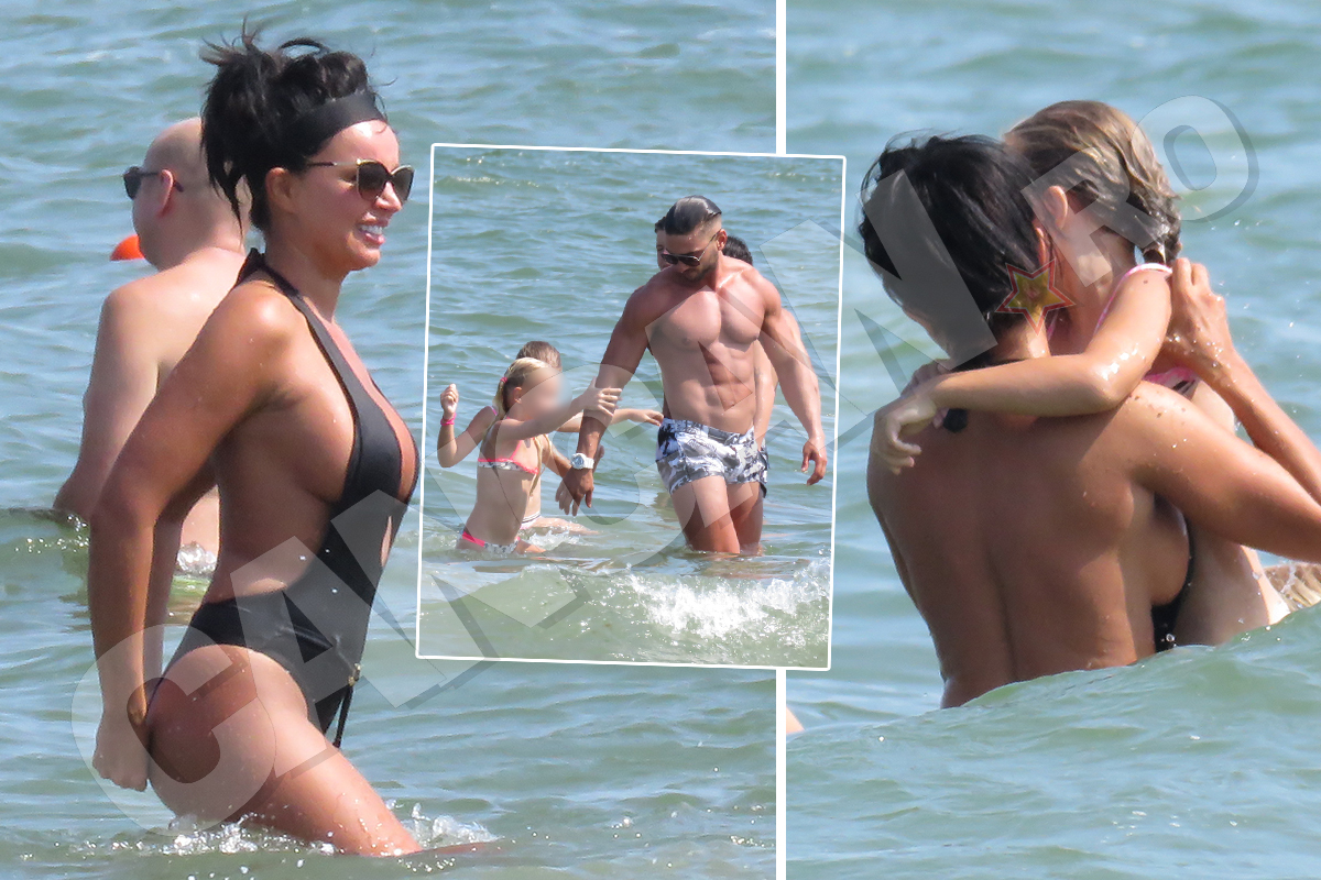 Dorian Popa şi iubita lui s-au distrat cu două fetiţe la mare.