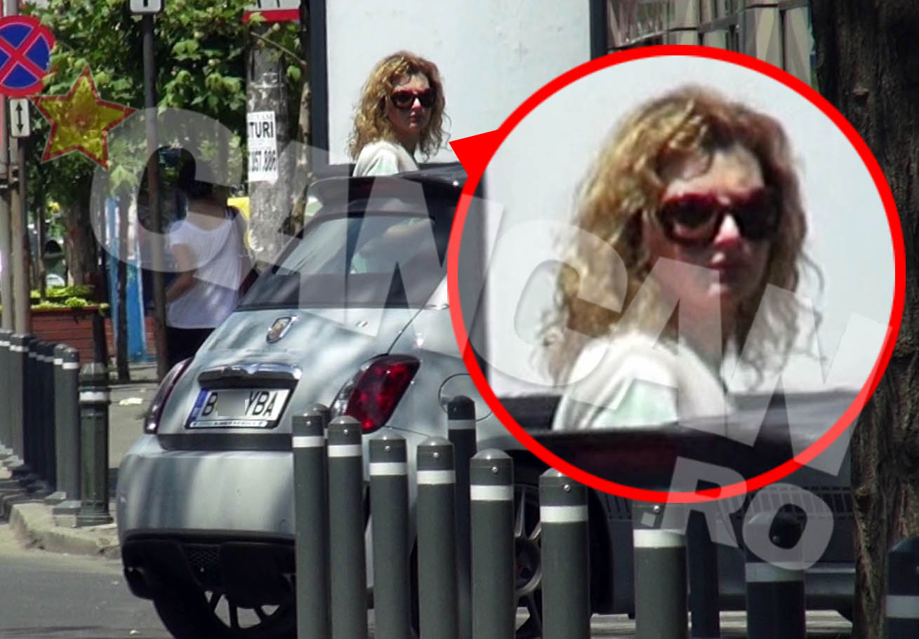 Ioana Basescu arunca priviri in stanga si-n dreapta imediat dupa ce iese din masina