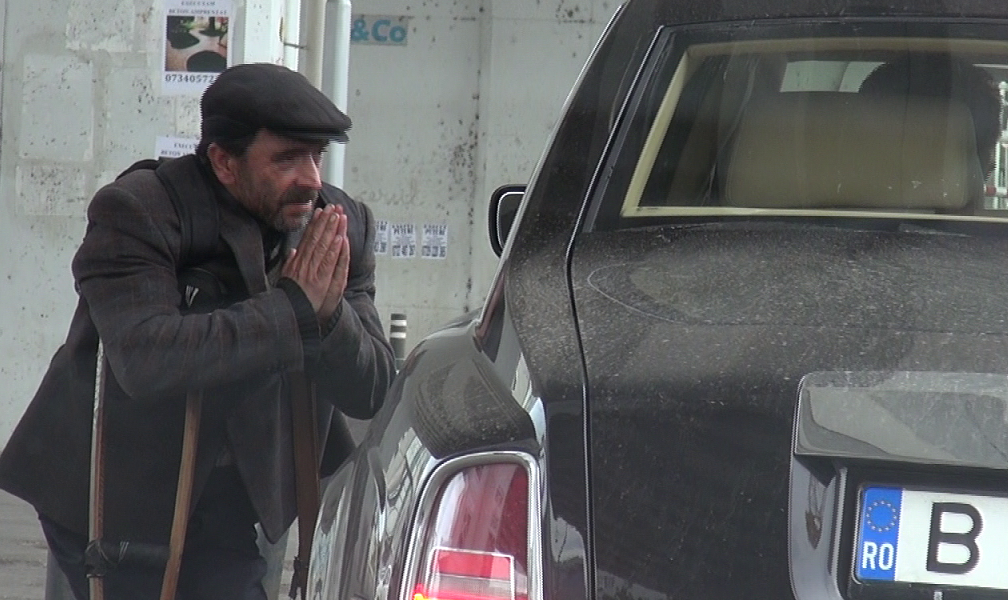 Edy de Romania si-a facut pomana cu un cersetor