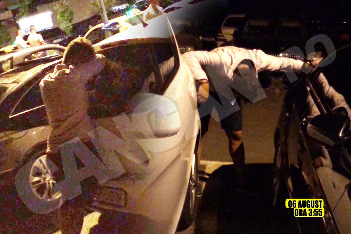 Al doilea petrecăreţ a fost la fel de băut şi s-a luptat cu gravitaţia, ţinându-se de... două maşini!