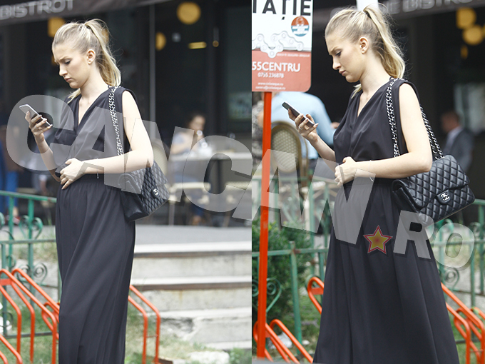 În timp ce mergea pe stradă, Ioana Marcu ţinea mâna pe burtică, fiind un gest tipic pentru graviduţe.