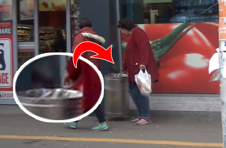 Femeia asteapta ca usiile de la magazin sa se inchida, pentru a lua tigara lasata langa cosul de gunoi de un client